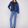 Blue denim quilted puffer jacket with 100% cotton exterior, featuring a sleek high collar by Charlie B.