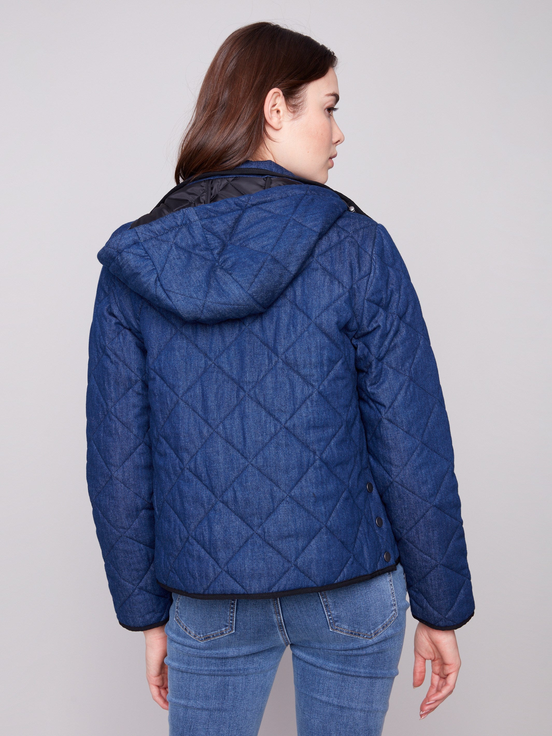 Stylish blue denim puffer jacket showcasing its removable hood and elegant design by Charlie B.
