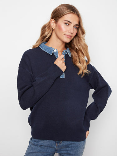 Stylish navy sweater with a half-snap denim placket, offering both comfort and versatility in your wardrobe by Charlie B.