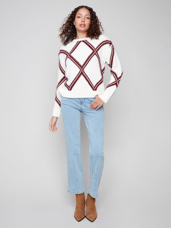 Elegant white sweater with cabernet diamond pattern, showcasing a stylish drop shoulder design by Charlie B.