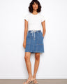 Denim skirt featuring convenient patch pockets for added style and practicality, perfect for casual outings. By Charlie B.