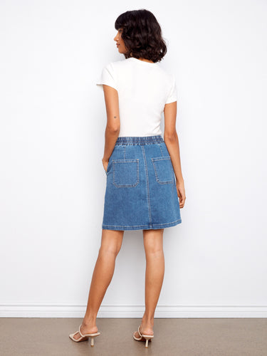 Versatile denim skirt with stylish details like patch pockets and an elastic waistband for everyday wearability. By Charlie B.