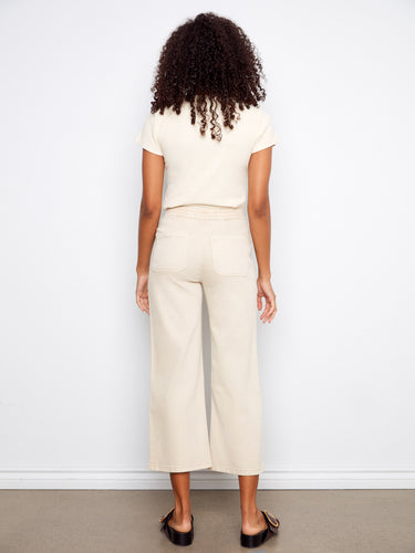 Elegant beige twill pants showcasing patch pockets and a modern cropped cut by Charlie B.