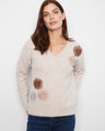 A cozy V-neck sweater featuring a relaxed fit, adorned with charming floral embroidery for a stylish touch. By Charlie B.