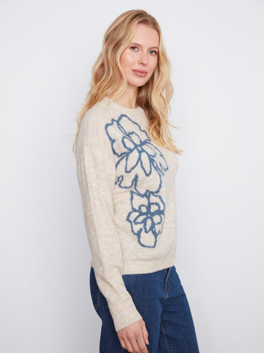 Featuring drop shoulders, this sweater offers a relaxed fit that pairs well with jeans for a stylish look by Charlie B.