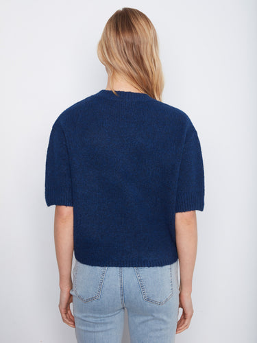Chic navy sweater made from soft brushed knit with elbow-length sleeves and stylish floral button accents at the cuffs by Charlie B.