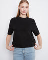Black sweater with a relaxed fit and soft brushed knit, perfect for casual wear by Charlie B.