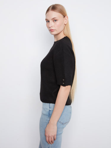 This black sweater features a mock neck and offers a versatile, relaxed fit by Charlie B.
