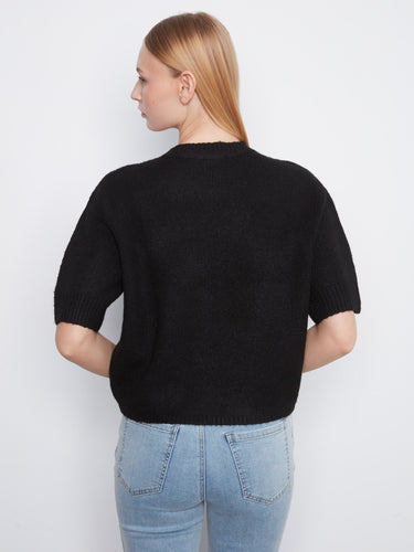 Crafted from soft brushed knit, this black sweater is ideal for cozy days by Charlie B.
