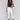 White twill pants in bootcut style with stretch fabric and tulip hem detailing by Charlie B.