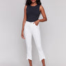 White twill pants in bootcut style with stretch fabric and tulip hem detailing by Charlie B.