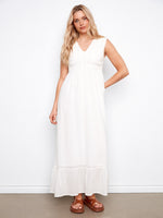 Natural sleeveless dress featuring an elegant V-neckline and flowing maxi length by Charlie B.