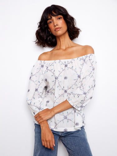 Chic 3/4 sleeve blouse featuring exquisite floral embroidery on breathable 100% cotton fabric. Perfect for any occasion by Charlie B.