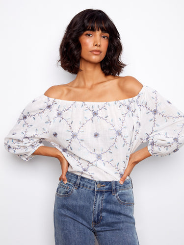 Fashionable blouse with unique floral embroidery and comfortable 3/4 sleeves. Enjoy the lightweight feel of cotton by Charlie B.