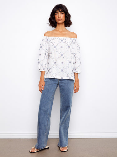Fashionable white top highlighting exquisite floral motifs and easygoing 3/4 sleeve design in pure cotton fabric by Charlie B.