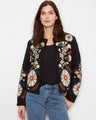 This jacket features a collarless style with intricate embroidery, offering a chic and modern look by Charlie B.