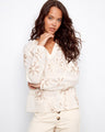 Ecru blouse with floral embroidery and a stylish braided collar detail, crafted from 100% cotton by Charlie B.