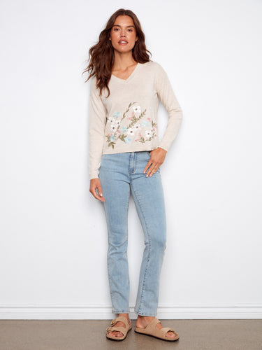 Elegant beige sweater featuring intricate floral embroidery and crafted from soft cotton for ultimate comfort by Charlie B.
