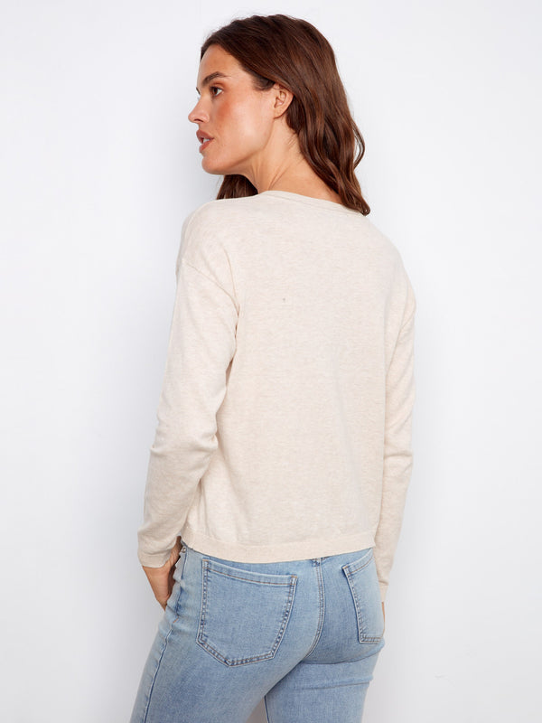 Stylish beige sweater highlighting delicate floral patterns, made from pure cotton for a cozy feel by Charlie B.