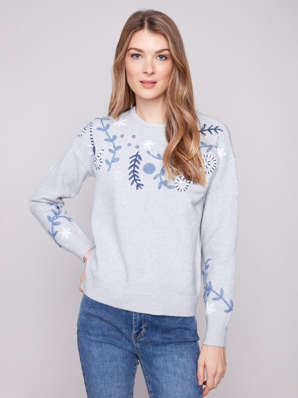 Heather grey sweater with a charming embroidered floral pattern, perfect for adding elegance to any outfit by Charlie B.