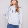 Heather grey sweater with a charming embroidered floral pattern, perfect for adding elegance to any outfit by Charlie B.