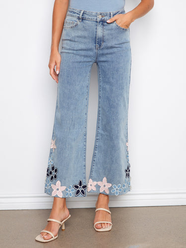 Cropped length jeans with five-pocket design, enhanced by intricate floral embroidery details. A trendy choice by Charlie B.