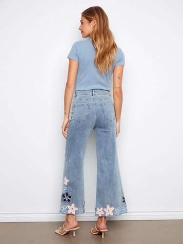 Floral embroidery elevates these regular rise jeans with a fashionable cropped length and raw hem finish. Crafted by Charlie B.