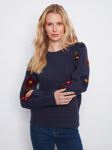 The long raglan sleeves on this sweater offer both comfort and style, making it a versatile wardrobe staple. By Charlie B.