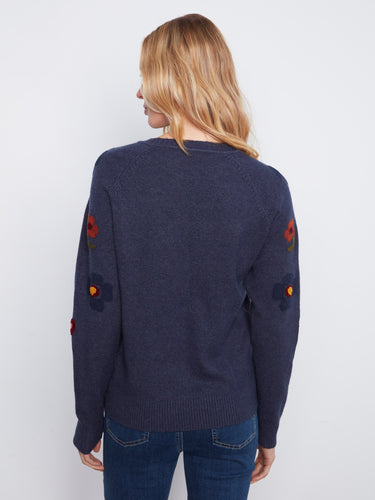 Crafted from soft fabric, this sweater combines comfort with chic embroidered details for everyday wear. Designed by Charlie B.