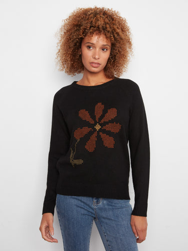 Black sweater with a crew neck and striking embroidered floral design, perfect for casual elegance by Charlie B.