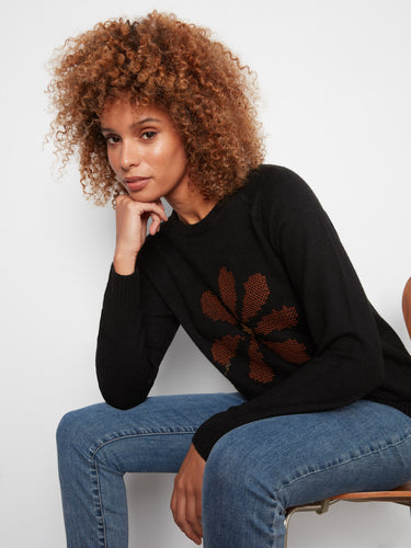 Stylish black sweater showcasing long sleeves and detailed floral embroidery for added charm by Charlie B.