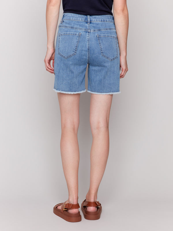 Blue denim shorts with unique fringed hem detailing by Charlie B.