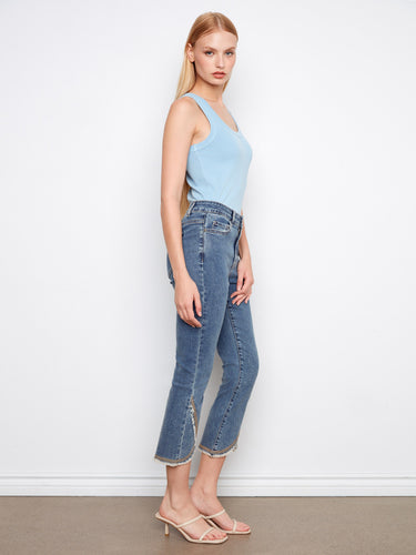 With a regular rise and slim fit, these jeans provide a flattering silhouette for any occasion. By Charlie B.