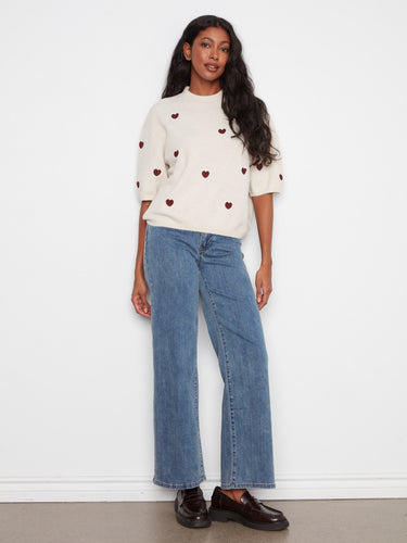 Relaxed fit top featuring delicate heart embroidery on soft fabric, ideal for casual outings. By Charlie B.