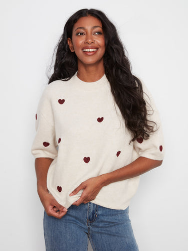 Elegant balloon elbow sleeves and relaxed fit make this sweater a versatile choice for any occasion. By Charlie B.