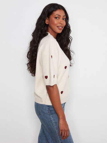 Embroidered hearts pattern on soft knit fabric offers both warmth and style in this relaxed fit piece. By Charlie B.
