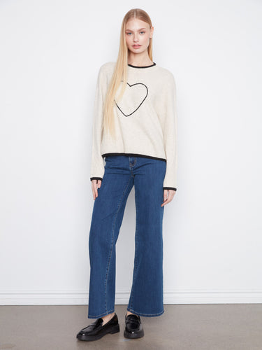 Featuring drop shoulders, this sweater offers a relaxed fit for effortless style and comfort. Designed thoughtfully by Charlie B.