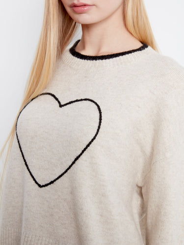The crew neckline complements the heart design on this sweater, creating an elegant look suitable for any occasion by Charlie B.