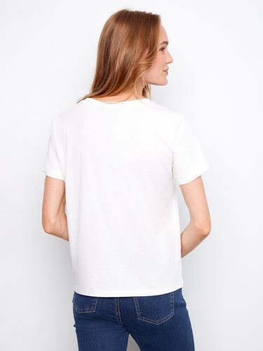 Embroidered hearts adorn this 100% cotton white T-shirt, offering both style and comfort in one piece by Charlie B.