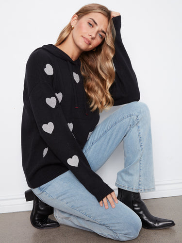 Casual black hoodie featuring intricate heart embroidery, crafted from soft knit material to keep you warm all season long by Charlie B.