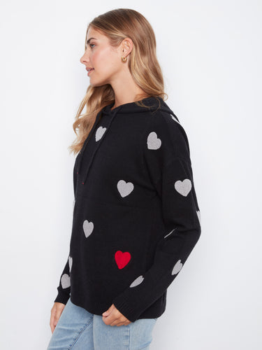 Fashionable black sweater adorned with intricate heart embroidery, offering warmth and style. By Charlie B.