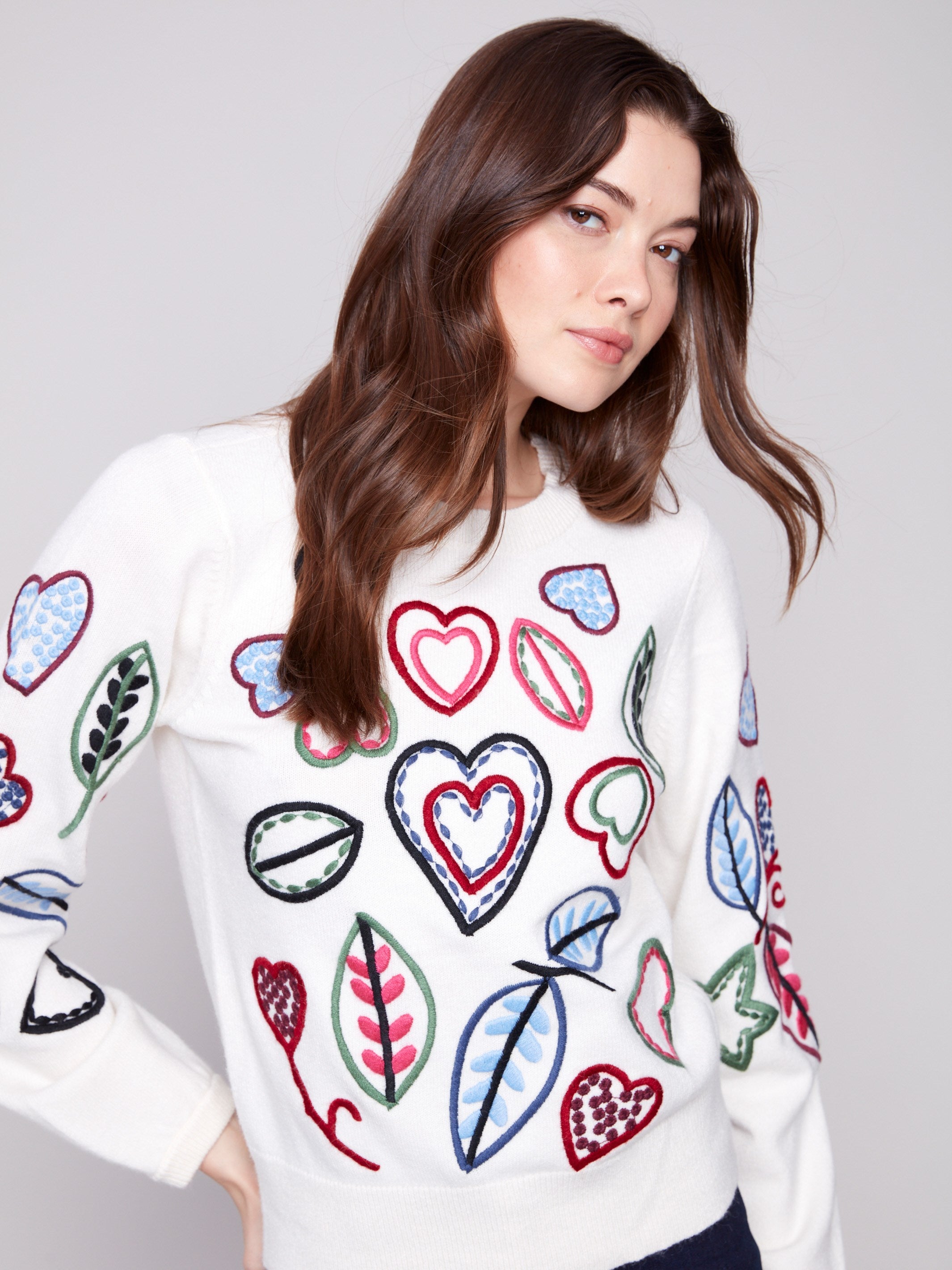 Sweater in ecru with vibrant heart and leaf embroidery details, featuring a classic crew neck by Charlie B.