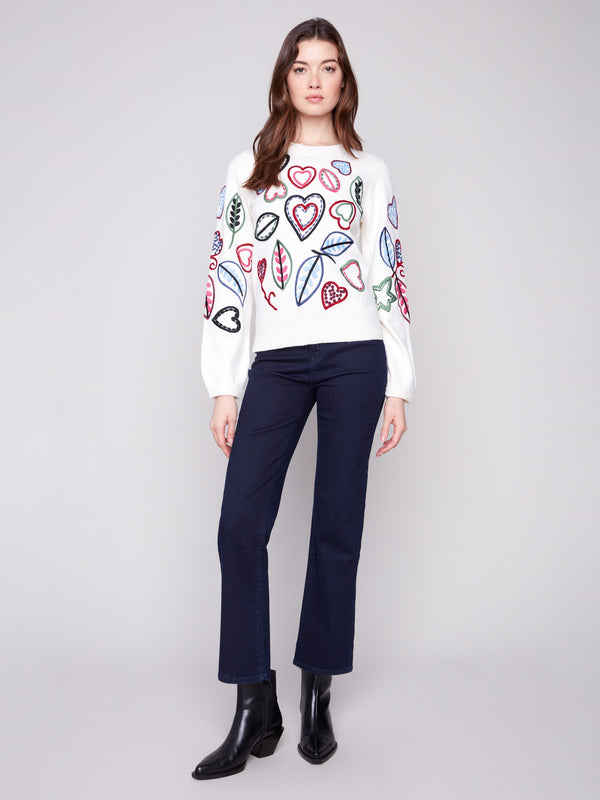 Chic ecru sweater with embroidered hearts and leaves, designed with stylish puff sleeves by Charlie B.