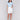 White denim skort featuring slim fit design by Charlie B.