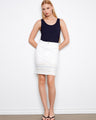 This skirt features a slim fit that flatters the silhouette, paired with a stylish navy tank top. By Charlie B.