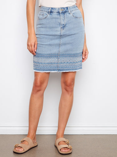 This denim skirt includes built-in shorts, offering both comfort and style. A versatile piece for your wardrobe by Charlie B.