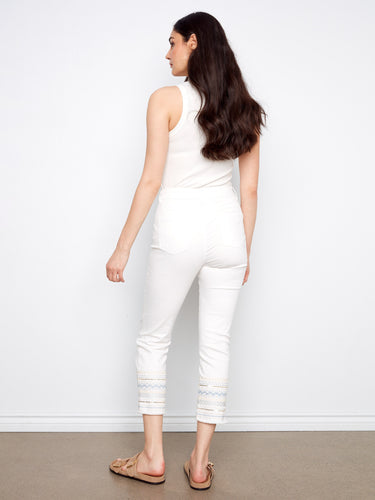 Stylish five-pocket white jeans in stretch denim featuring an embroidered hem for added flair and comfort by Charlie B.