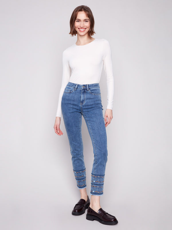 Medium blue jeans featuring a regular rise and stretch denim material, ideal for comfort and style by Charlie B.