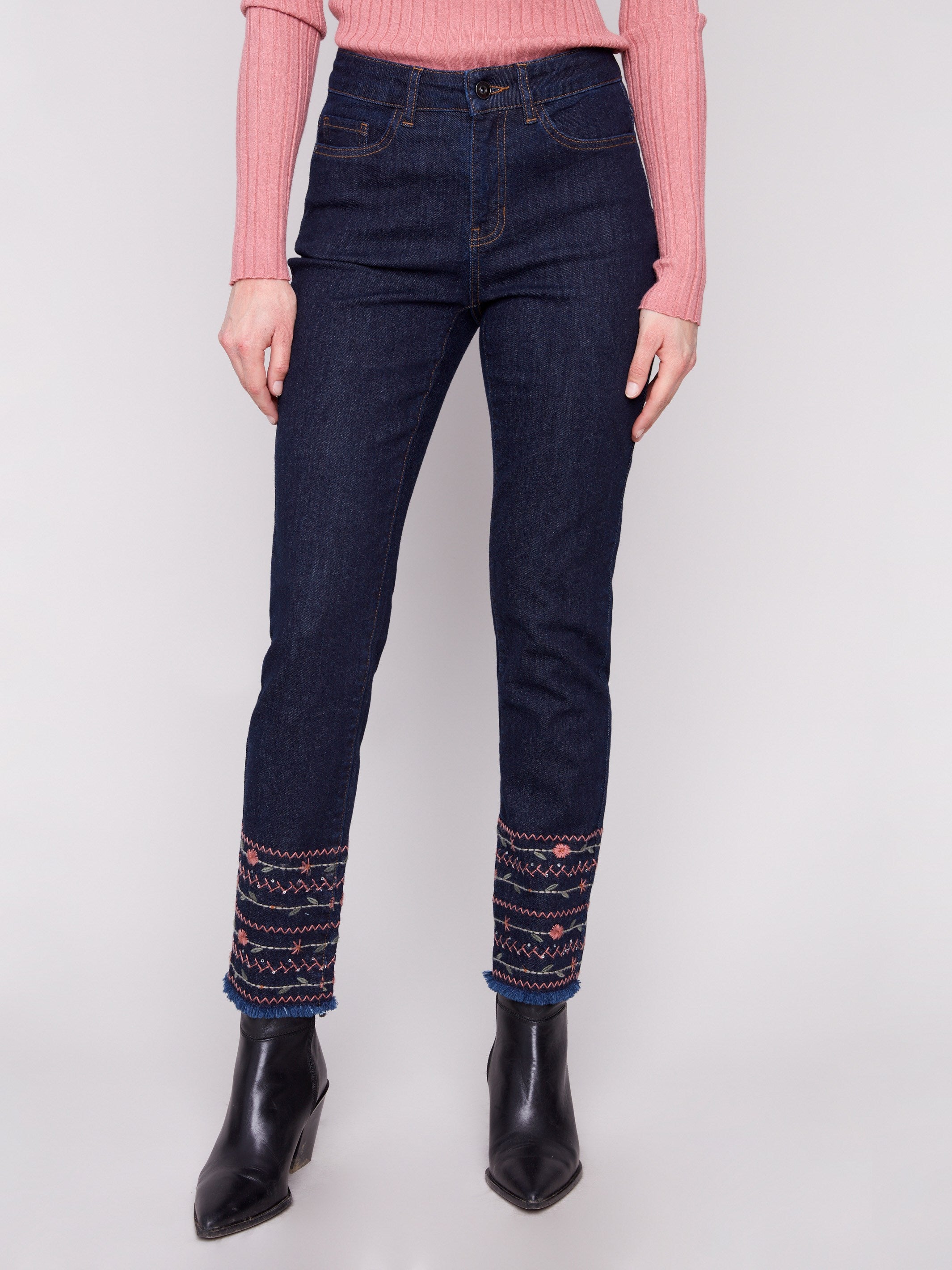 Stretch denim jeans in rich blue, showcasing a five-pocket design and detailed embroidered hems by Charlie B.