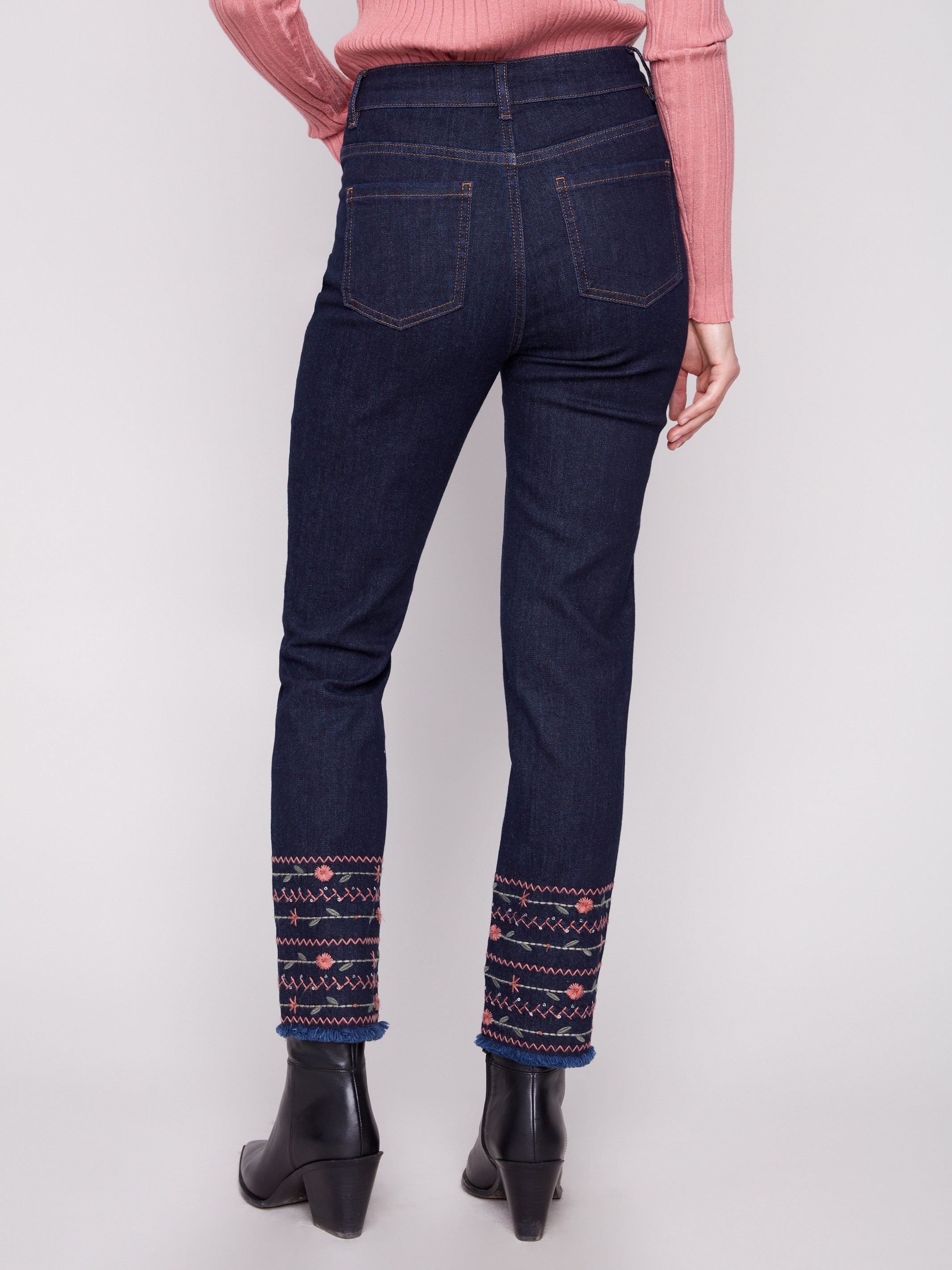 Ankle-length slim jeans in deep blue with regular rise, highlighted by artistic hem embroidery by Charlie B.